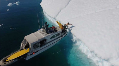 Daredevil Slides Down Iceberg on Inflatable Pizza